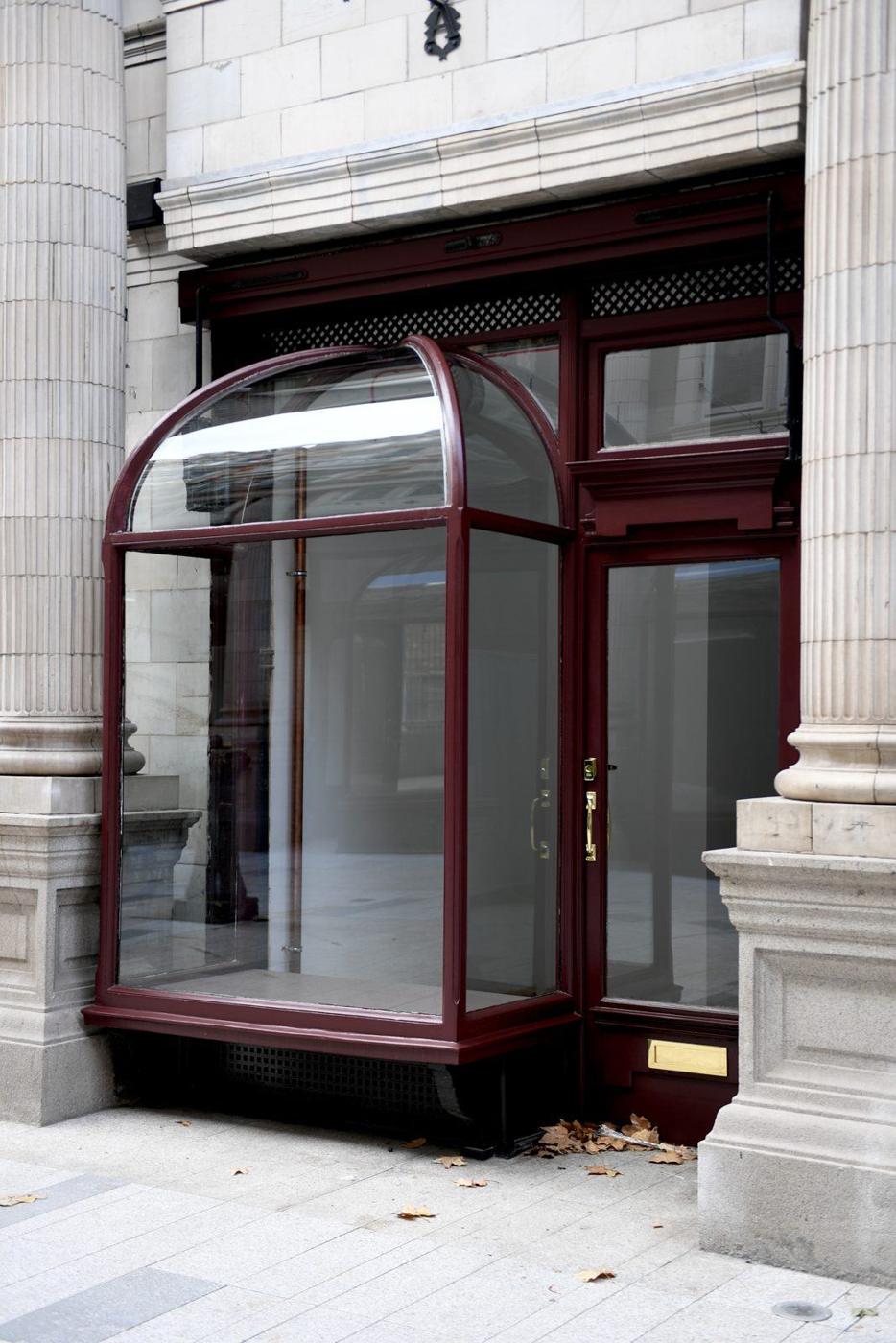 The new Santo Cielo shop on Sicilian Avenue, Holborn: a curved bow window and door in dark red between stone columns