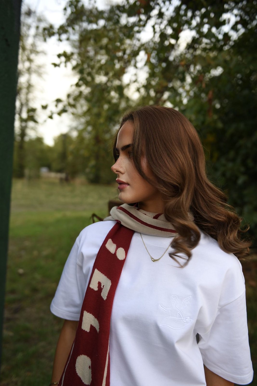 Someone in the white Santo Cielo angel tee and the red and cream OG scarf